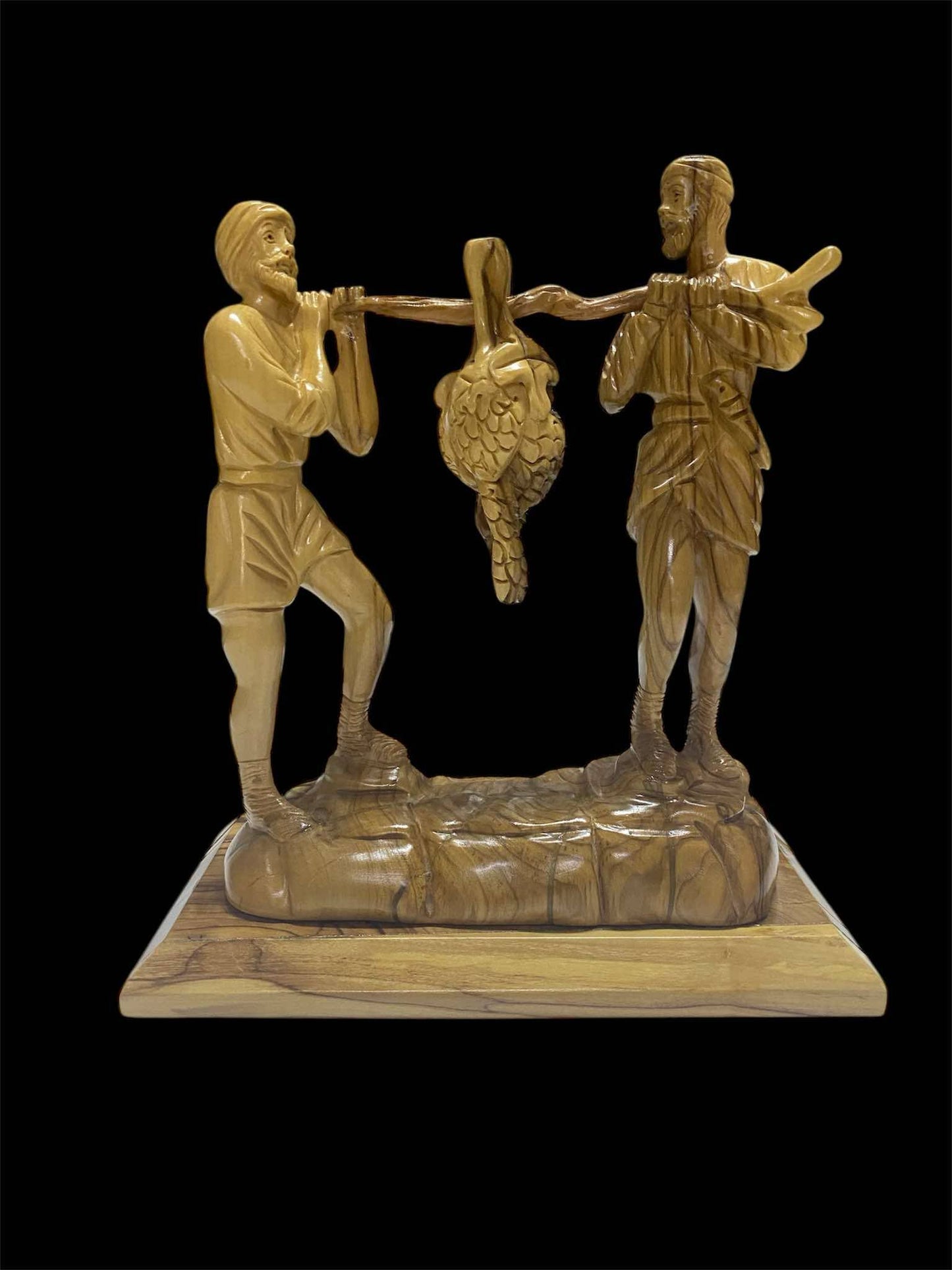 Joseph and Caleb carrying grapes
